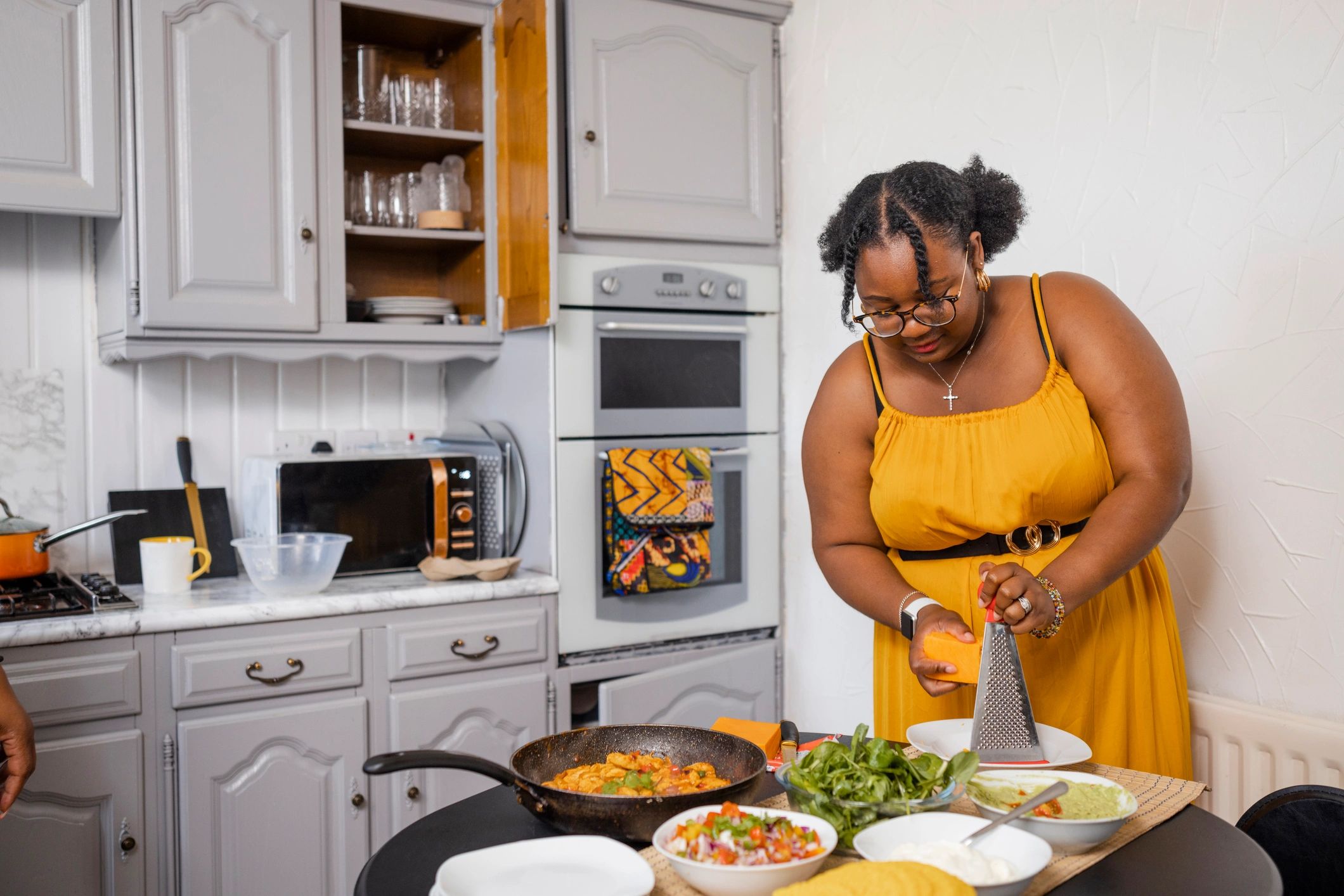 Woman working in a bright kitchen setting