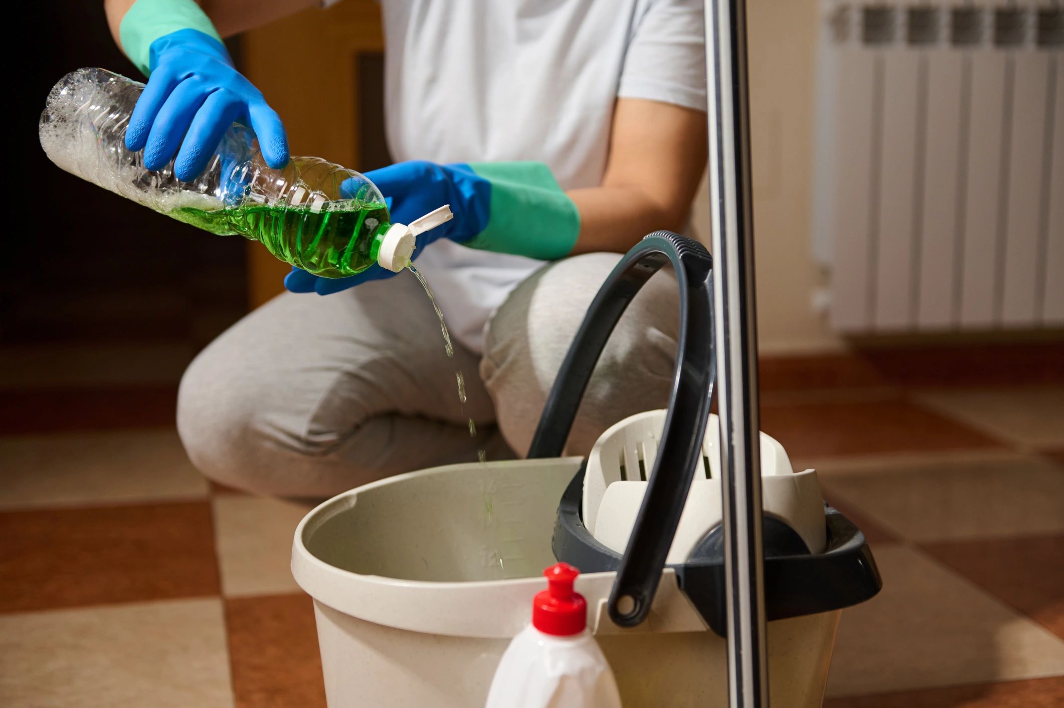 Cleaner preparing supplies for a detailed cleaning job